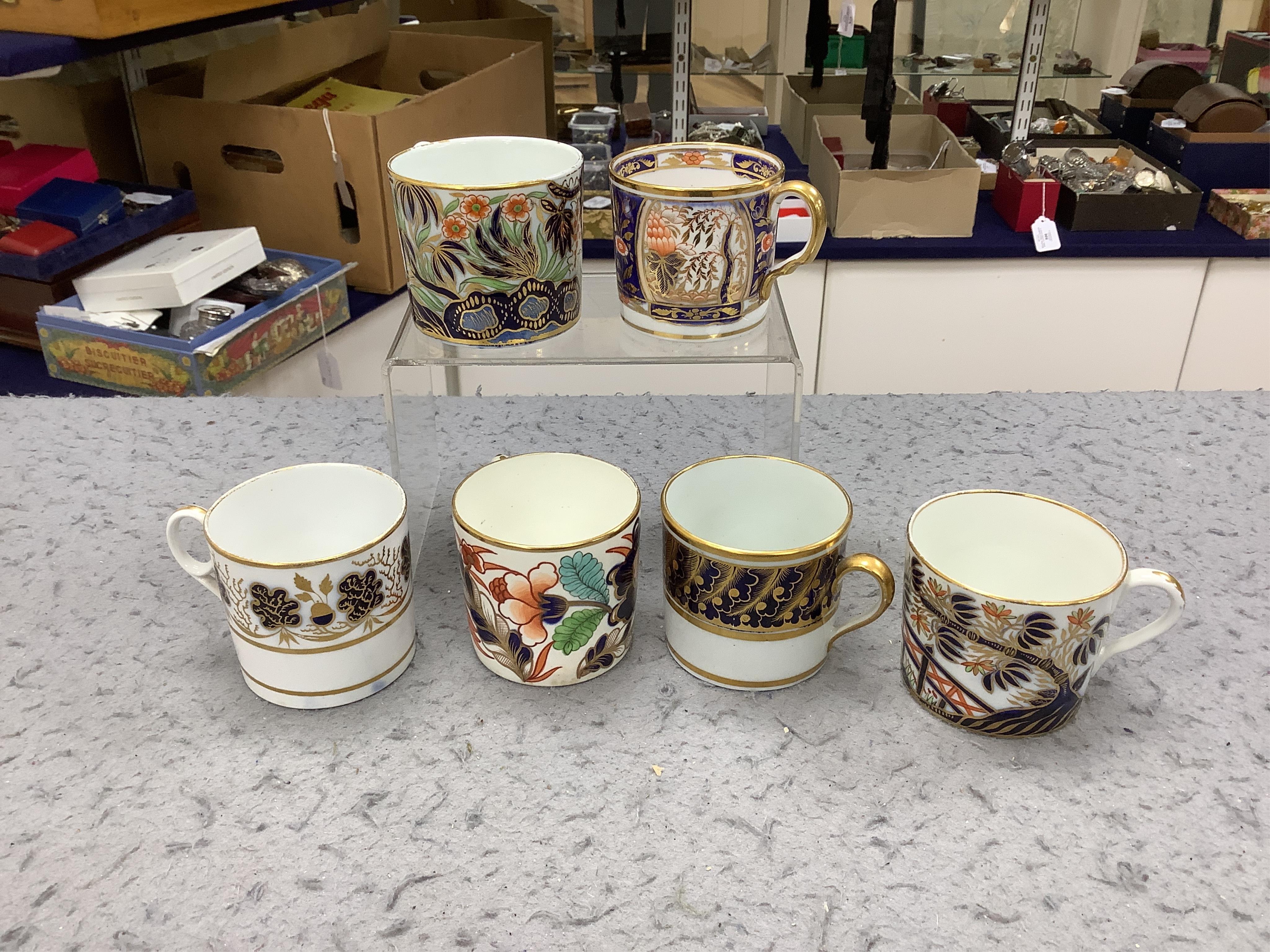 Twelve 1800-1820 English porcelain coffee cans, including Imari pattern examples